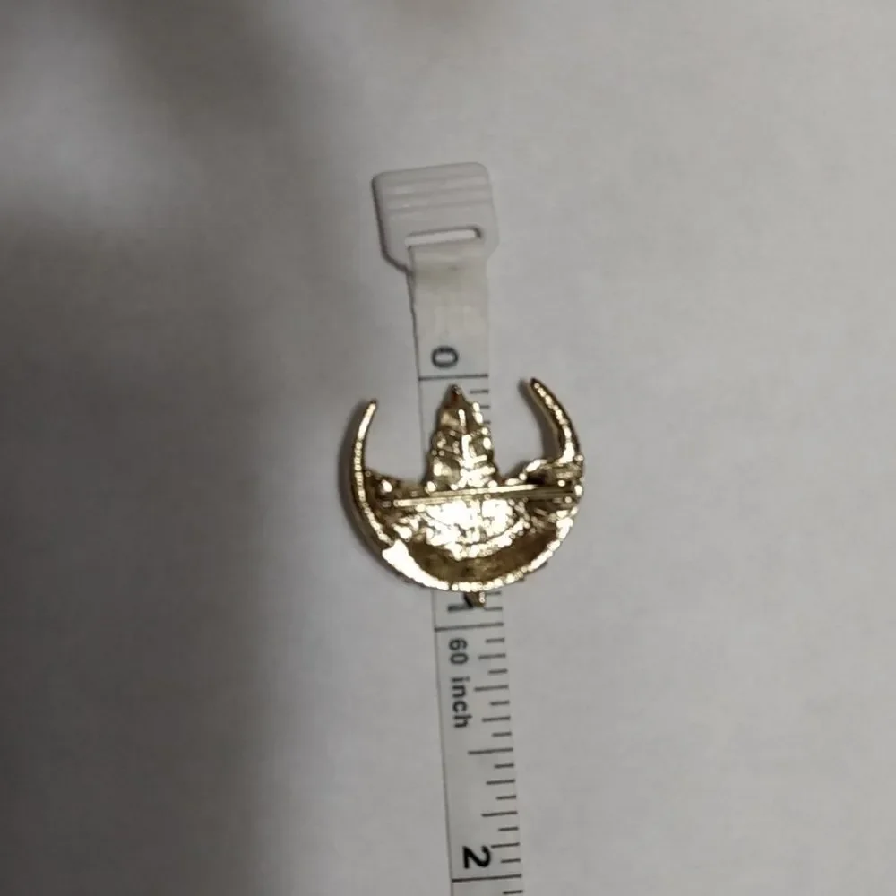 Gold tone rhinestone leaf brooch